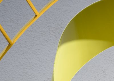 Closeup of Echo, a contemporary yellow sculpture - Kevin Caron
