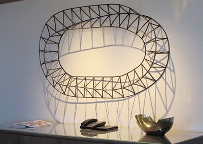 Shade and Shadow, a contemporary steel wall sculpture by Kevin Caron.