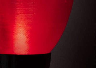 Detail of Gumdrop, a lighted red transparent sculpture - Kevin Caron