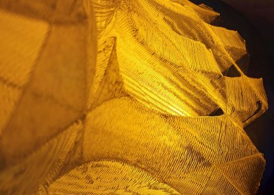 Closeup of Solar Reactor, a large format, translucent yellow 3D printed sculpture, lighted - Kevin Caron