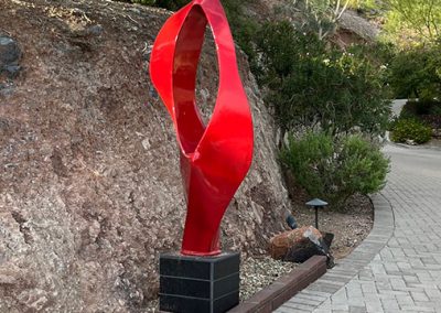 SeeThrough, a contemporary red sculpture at dusk - Kevin Caron