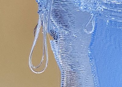 A detail of Ice Queen, lighted translucent blue 3D printed sculpture - Kevin Caron