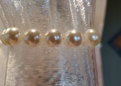 Closeup of contemporary sculpture Debutante's string of pearls - Kevin Caron