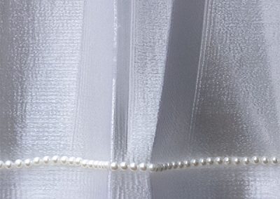 Closeup of the contemporary 6 foot tall sculpture Debutante's string of pearls - Kevin Caron
